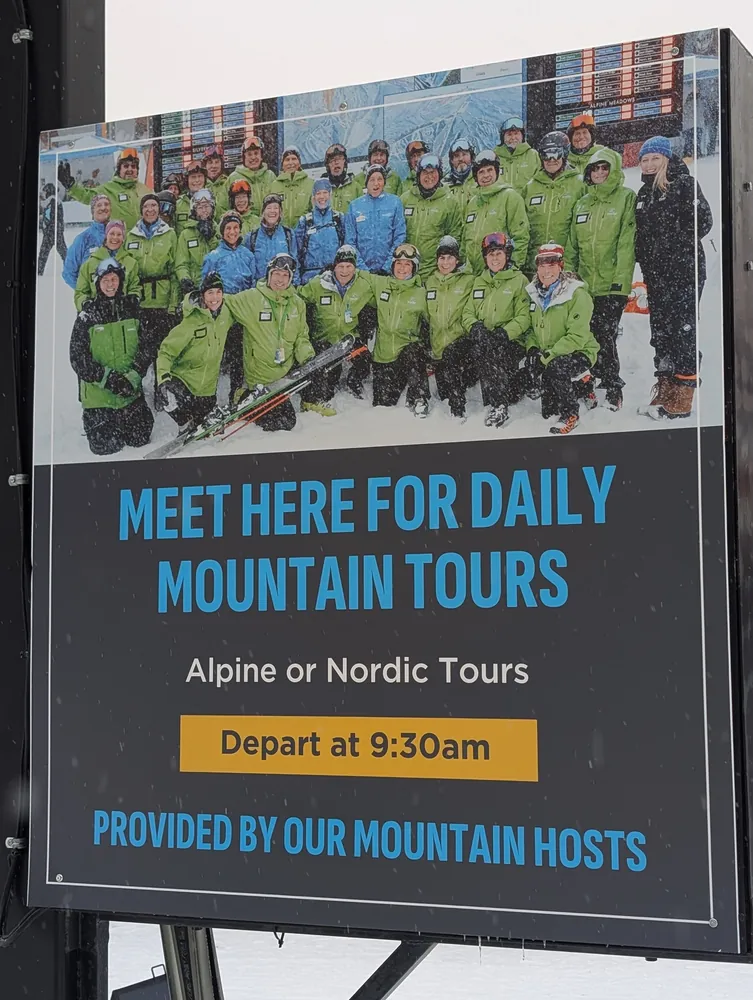 Sign reading Meet here for daily mountain tours, Alpine or Nordic, depart at 9:30am