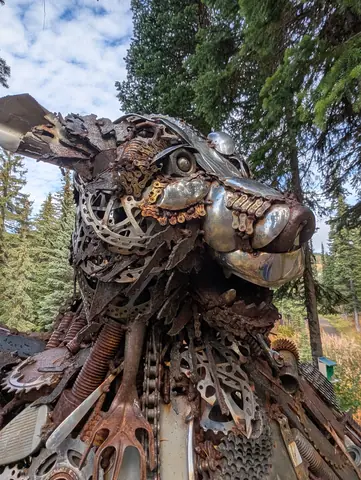 Close-up of the scrap-metal bear’s head made of tools and gears