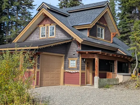 Timber-frame chalet with stone and wood details
